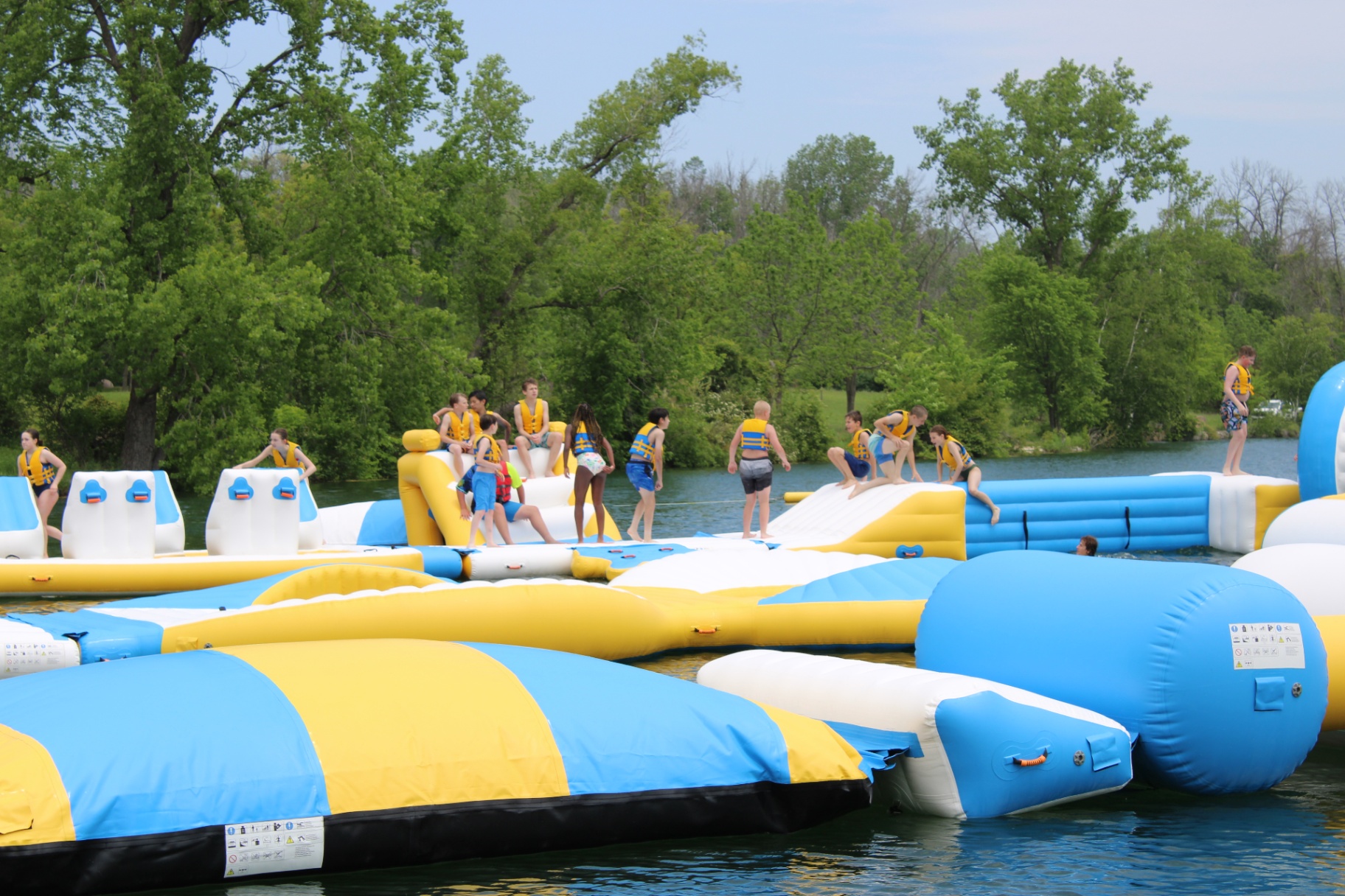 Group of swimmers on the floating obstacle course