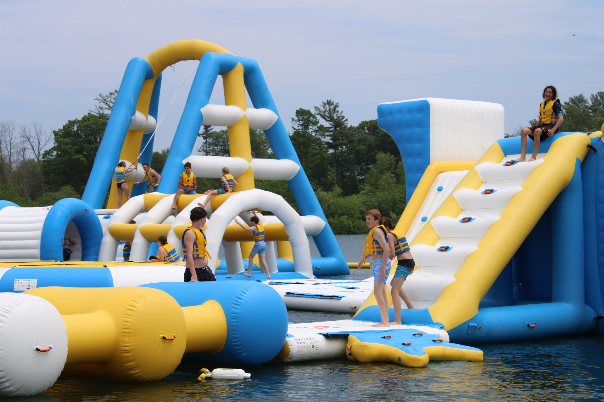 Kids climbing the inflatable tower at Sheboygan Quarry